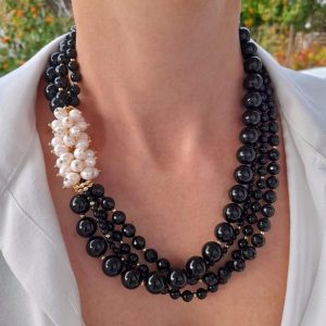 Handmade Multi-strand Onyx statement necklace combined with fresh water pearls and gold plated elements