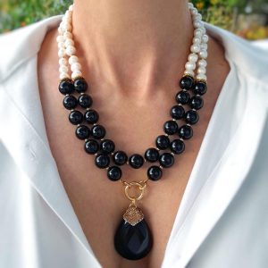Handmade Multi-strand Onyx statement necklace combined with fresh water pearls and gold plated elements